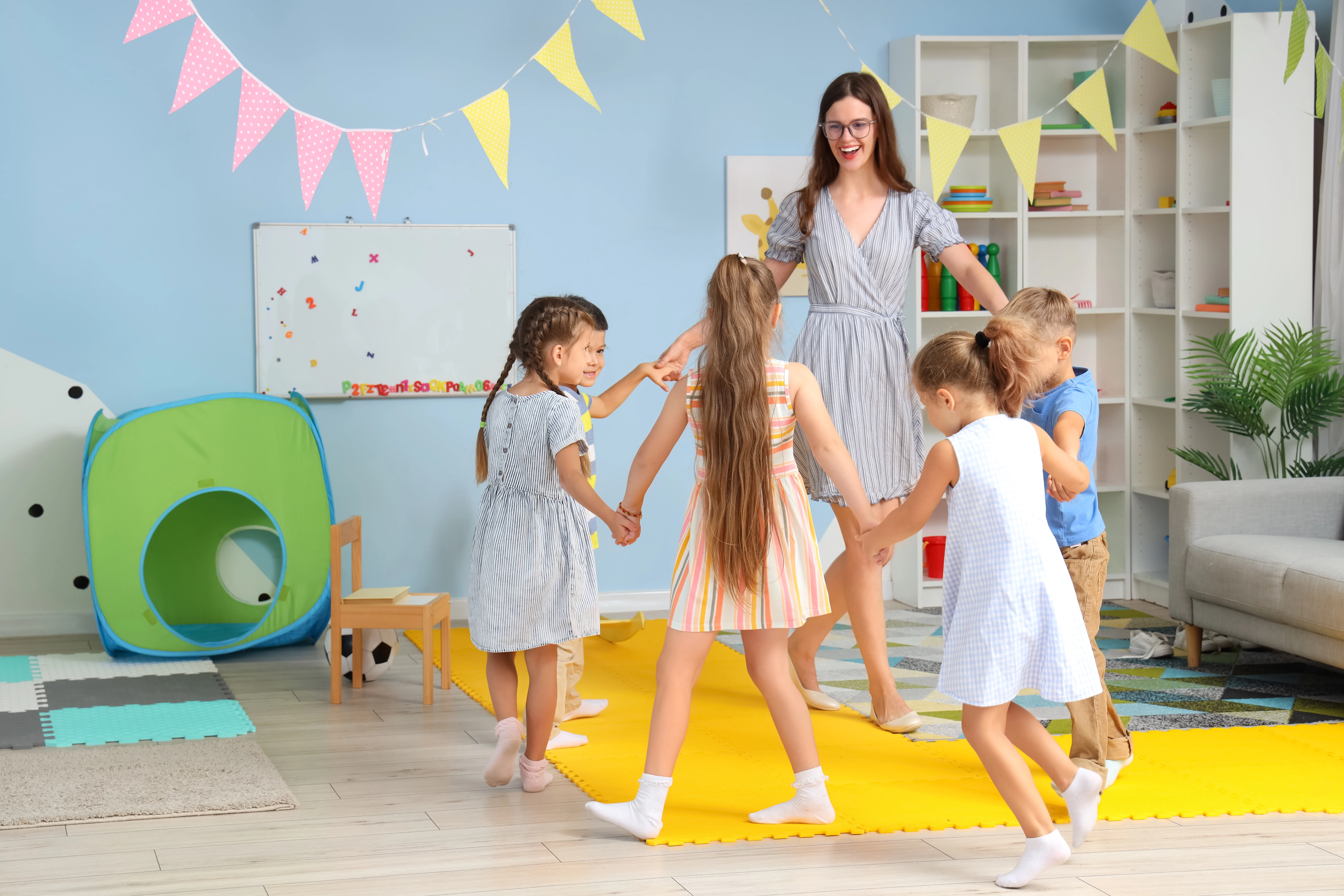 Teacher And Children Playing Shutterstock 2456016035